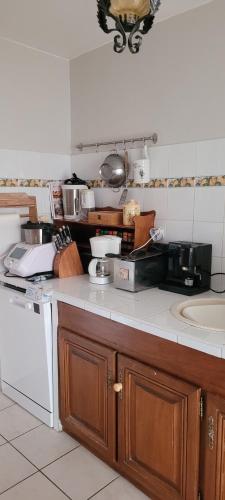 a kitchen with a sink and a counter top at Appartement 7 couchages in Salon-de-Provence