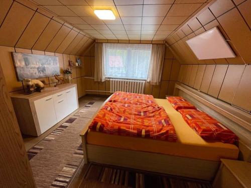 a bedroom with a large bed in a room at Ferienwohnung Katharina in Stolberg (Harz) in Stolberg