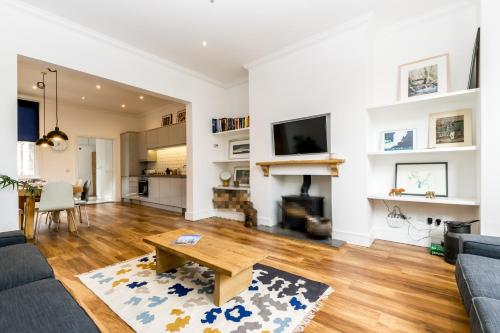 a living room with a couch and a table at City Apartments - Priory Street in York