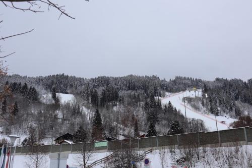 a snow covered mountain with a ski slope in the distance at Landhaus-Appartements Warraich in Schladming