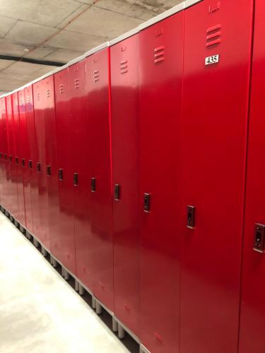 a row of red lockers in a building at New Gudauri Loft 2 Apartment 129 in Gudauri
