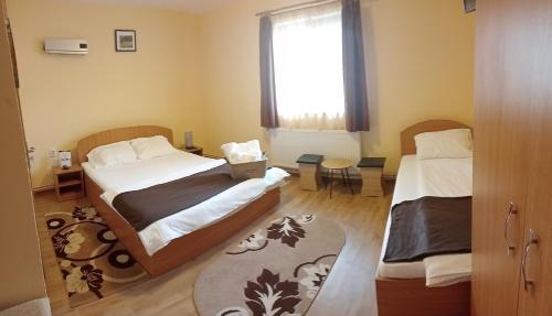Postel nebo postele na pokoji v ubytování Casa Raisa & Maria