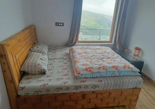 Ένα ή περισσότερα κρεβάτια σε δωμάτιο στο Blissful Home Stay