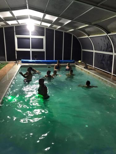 a group of people swimming in a swimming pool at Casa el Francés in Graus