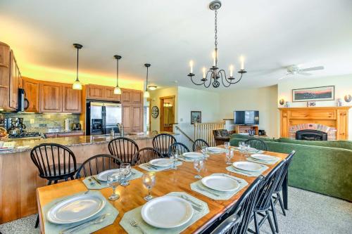 a dining room and kitchen with a table and chairs at Inviting Ski-inandSki-out Condo at Jay Peak Resort! in Jay
