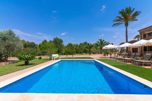 a swimming pool in the backyard of a villa at Can Sanchez in Campos