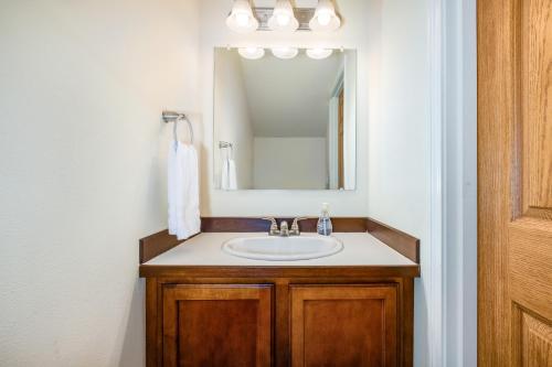 a bathroom with a sink and a mirror at Harmony Hills #227 in Anchorage