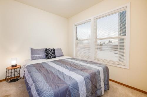 a bedroom with a bed and a large window at Harmony Hills #227 in Anchorage