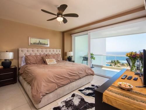 a bedroom with a bed and a large window at Modern- Renovated- Breathtaking 6th Floor- 3 Bedrooms Villa Magna in Nuevo Vallarta 