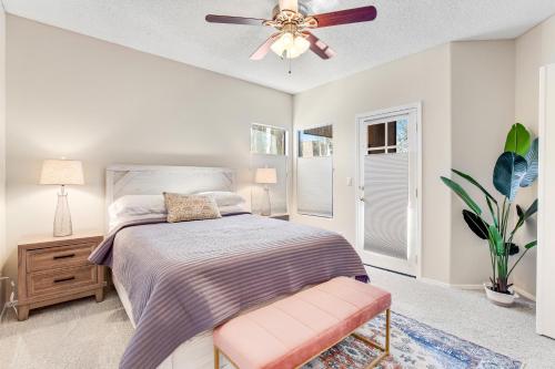 a bedroom with a bed and a ceiling fan at Canyon Crest Condo in Tucson