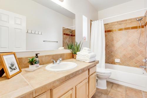 a bathroom with a sink and a toilet at Canyon Crest Condo in Tucson