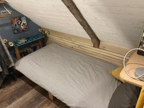 Postel nebo postele na pokoji v ubytování Le Loft de l'auberge du Lac Noir