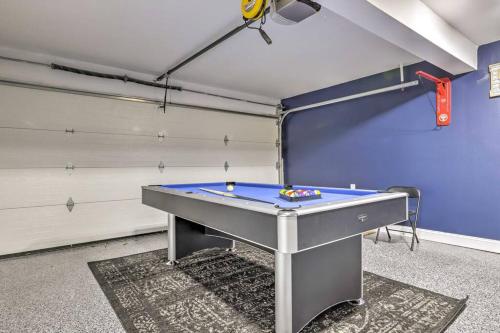 a ping pong table in a garage at NEW! Updated Mystic Home w/ Sauna, Hot Tub & Deck in Mystic