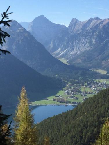 a view of a valley with a lake and mountains at Ferienwohnung Gruber-Hansen in Kaltenbach