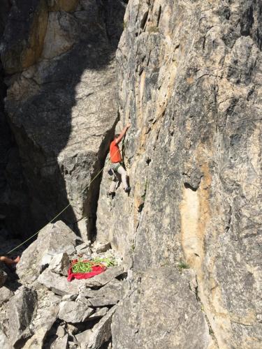 a man is climbing a rock wall on a mountain at Ferienwohnung Gruber-Hansen in Kaltenbach