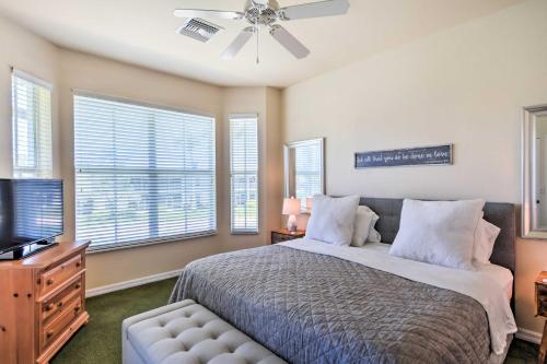 a bedroom with a bed with a ceiling fan and windows at Beautiful Naples Golf Villa in Famous Lely Resort! in Naples
