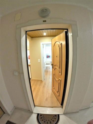 a small hallway with a door in a room at Carnaxide modern T1 apartment w balcony in Carnaxide Oeiras Lisbon in Carnaxide