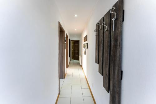a hallway of a house with wooden doors at Vila Veve in Sighişoara