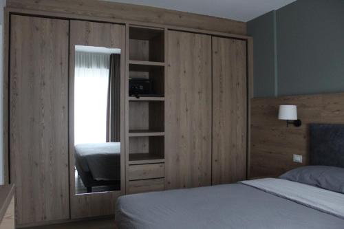 A bed or beds in a room at DolceAmbiez Apartments