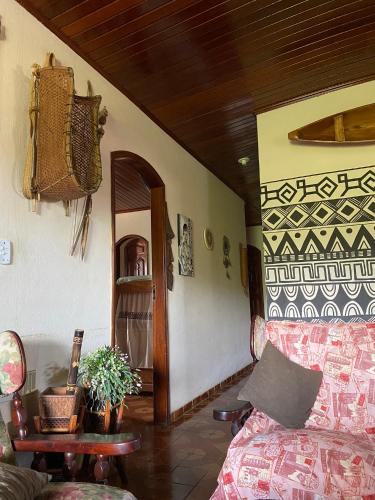a person standing in a living room looking in a mirror at Hostel Roraima in Boa Vista
