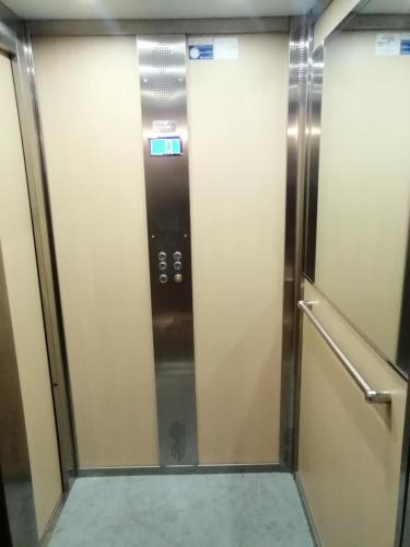 a elevator in a subway train with a door at Hotel de Rossi in Bari