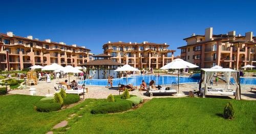 a resort with a swimming pool and some buildings at Sea stars Kaliakria resort in Topola