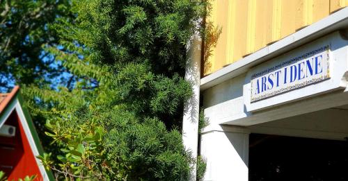 a sign on the side of a building at Engø Gård Hotel & Restaurant in Tjøme