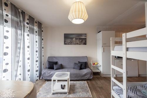a bedroom with a bed and a bunk bed at Nart&Niar in Annemasse