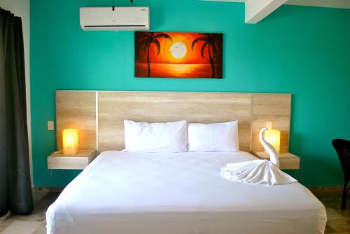 Ein Bett oder Betten in einem Zimmer der Unterkunft Hotel Punta Esmeralda