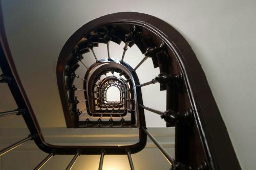 an overhead view of a spiral staircase at Hôtel Odessa Montparnasse in Paris