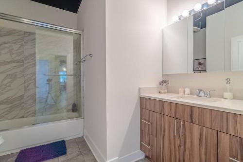 a bathroom with a shower and a sink at McCormick Place Spacious family heaven 3b/2b with optional parking that sleeps up to 8 in Chicago