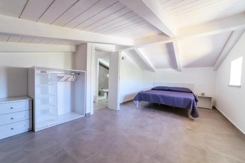 Un pat sau paturi într-o cameră la Villa Luisa Cilento