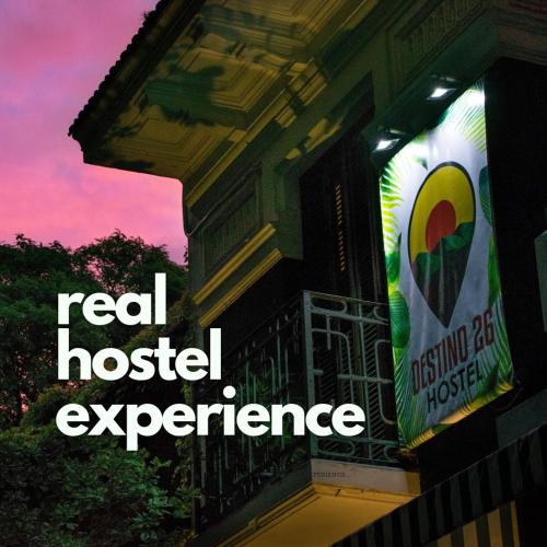 a sign for a real hospital experience on a building at Destino26 Hostel in Montevideo