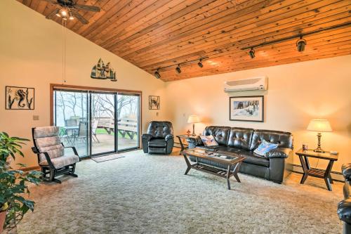 a living room with a leather couch and chairs at Brocton Escape Skiing, Snowtubing, Hiking! in Brocton