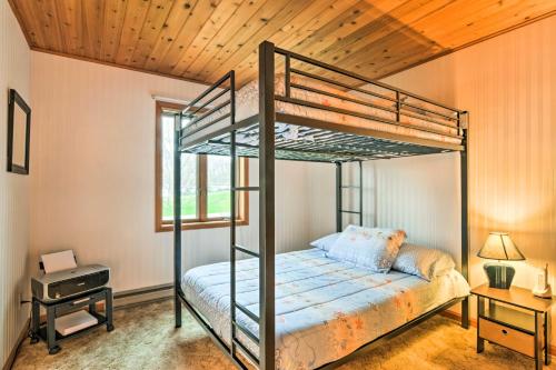 a bedroom with a bunk bed and a window at Brocton Escape Skiing, Snowtubing, Hiking! in Brocton