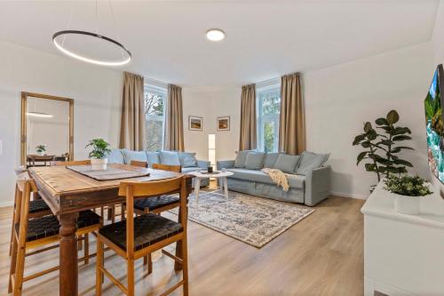a living room with a table and a couch at Byt v harmónii s prírodou in Modra