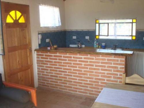 a kitchen with a brick counter and a sink at fatima cabaña 4personas in Villa de Las Rosas