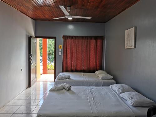 Postel nebo postele na pokoji v ubytování Hotel Puerto San Luis