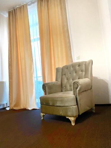 a chair sitting in front of a window at New Continent in Bushtyno