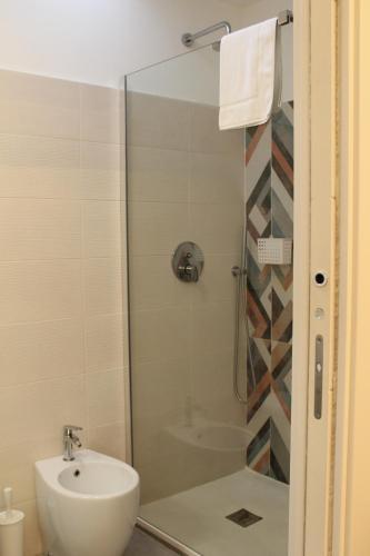 a bathroom with a shower and a sink at Margiò House in Sorrento