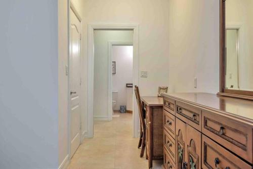 a bathroom with a sink and a vanity with a mirror at Spacious 1BR APT Half Mile to Beach Pets Welcome in Lake Worth