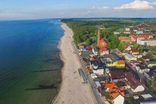 an aerial view of a beach and the ocean at Holiday homes close to the beach Sarbinowo in Sarbinowo