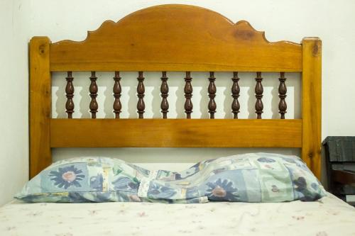 Un pat sau paturi într-o cameră la Hotel Rabin Itzam
