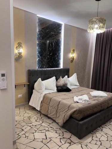 A bed or beds in a room at Residenza N&D Luxury