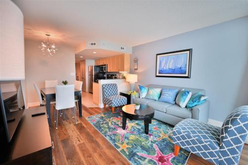 a living room with a couch and a table at Luxury 2 bedroom 2 bathroom Ocean Front Condo on the 12th floor for 8 in Myrtle Beach