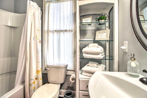 a bathroom with a toilet and a sink and a shower at Chic Thomas Square Home in Walkable Location! in Savannah