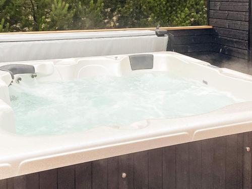 a jacuzzi tub sitting on top of a building at Holiday home Væggerløse CCXVII in Bøtø By