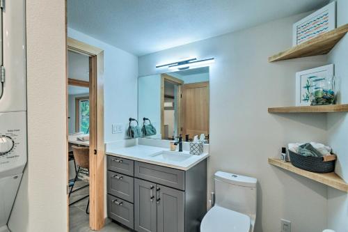 a bathroom with a sink and a toilet at Dreamy Bayfront Cabin with View, Dock and Kayaks in Olympia