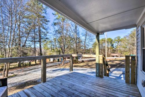 a porch with a view of the woods at Private Yard and Fire Pit Commerce Home! in Commerce