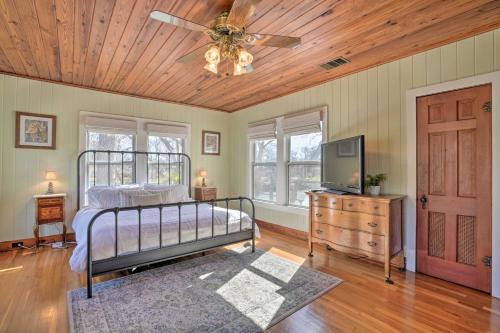 a bedroom with a bed and a ceiling fan at Spacious Lake Placid Retreat with Gorgeous Views! in Seguin